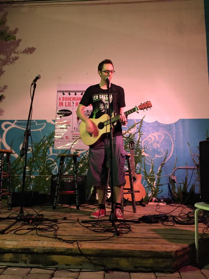Brian LeBlanc playing at Blue Talisman open mic in his Ed Sheeran tour shirt